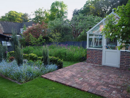 The Hartley Botanic plant house and sumptious borders