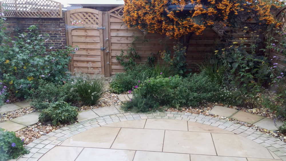 Circular patio with lush planting